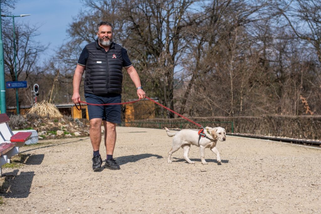 Csaba while walking Naspolya who is on a leash