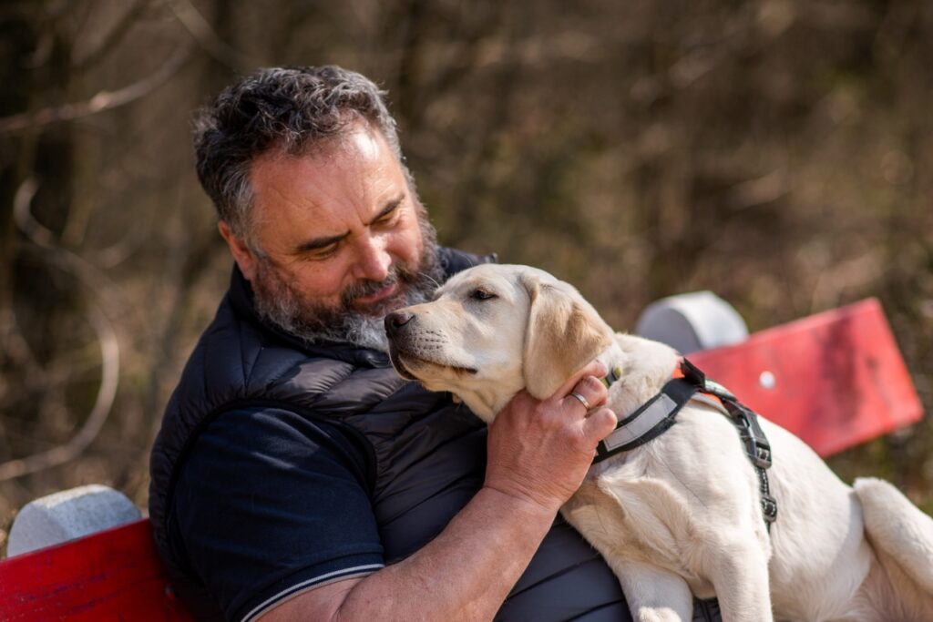 Csaba sitting with Naspolya in his lap.