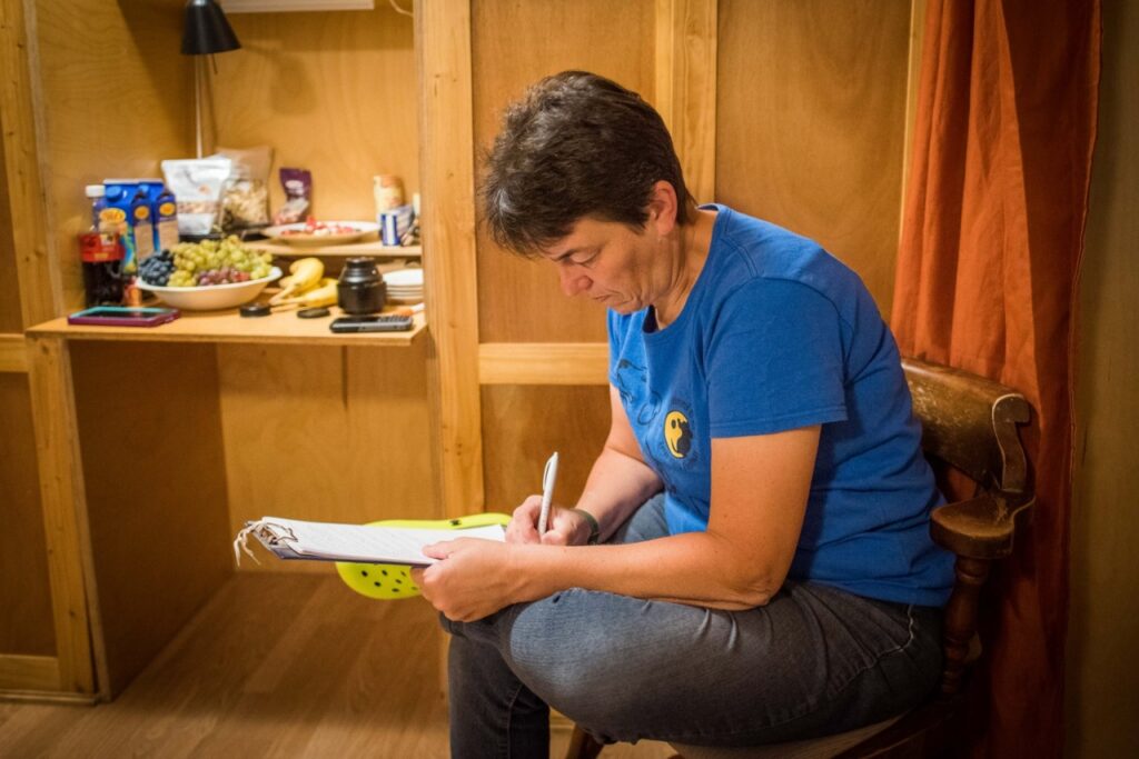 Piroska Komondi, taking notes of the puppies.